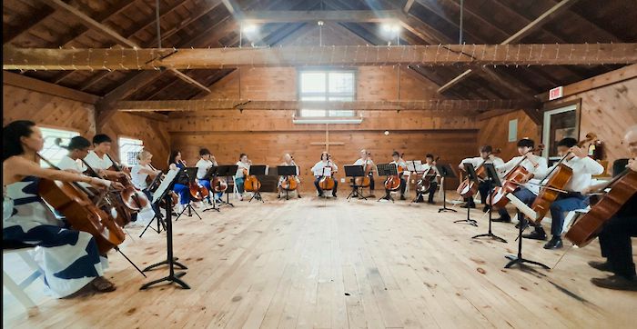 Directing cello ensemble concert at Cello Retreat